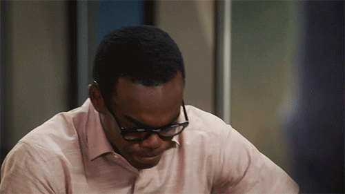 A man rocks back and forth, shaking his head