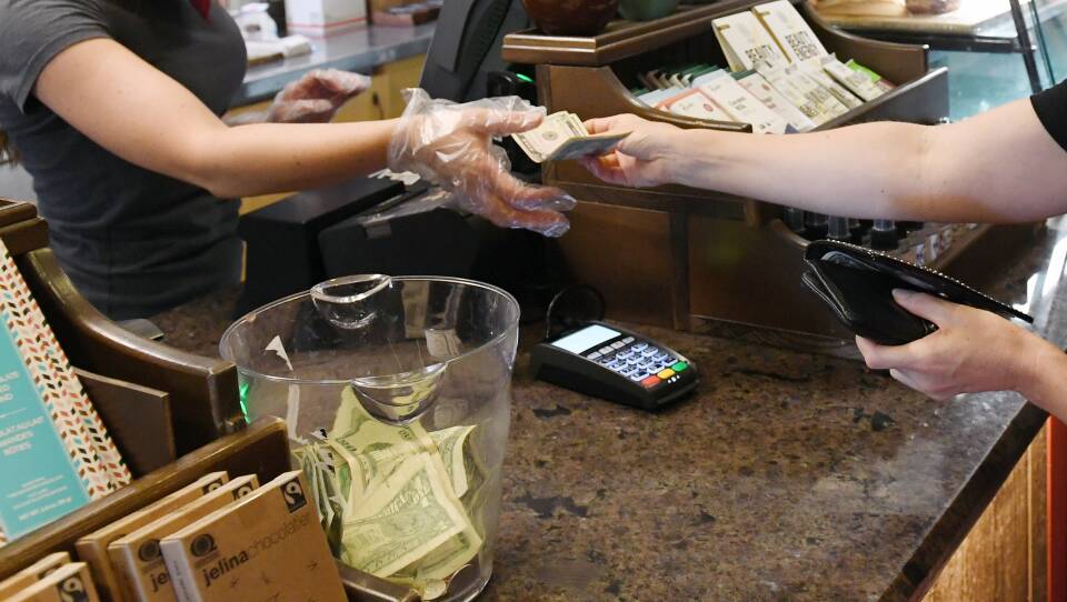 Tipping machines have replaced tip jars in many places as more people pay electronically.
