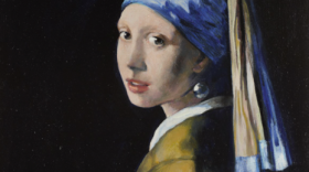 A painting of a young woman wearing a head scarf and large pearl earring. The brushstrokes are large and the colors light on a black background, so she stands out in an almost dream-like state.