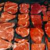 Rows of raw steaks, T-bones and other cuts of beef.