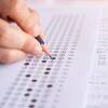 Childs Hand Filling In Multi-Answer Test With Pencil