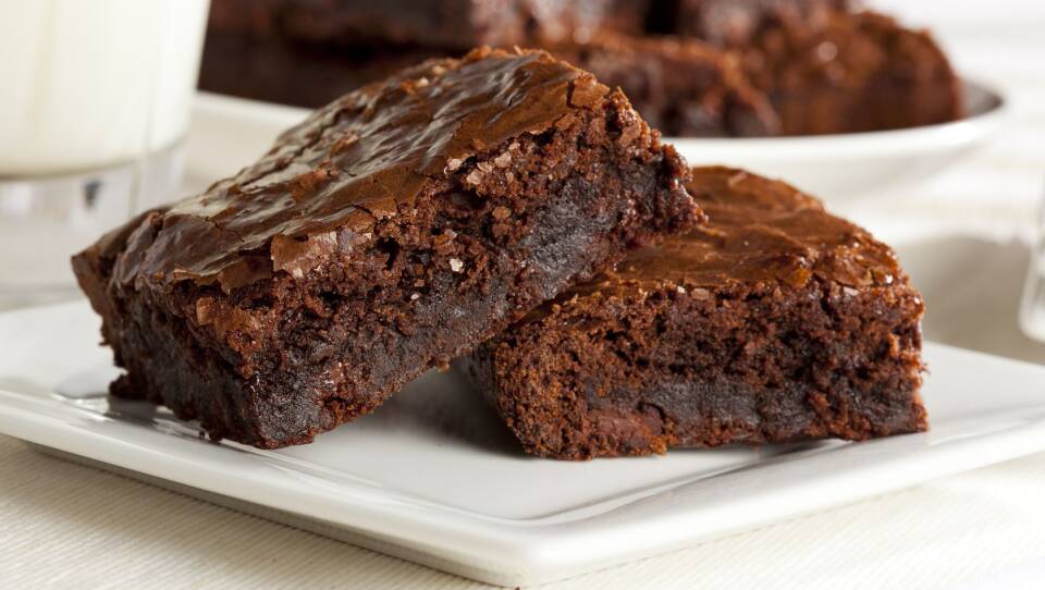 Two brownies on a plate.