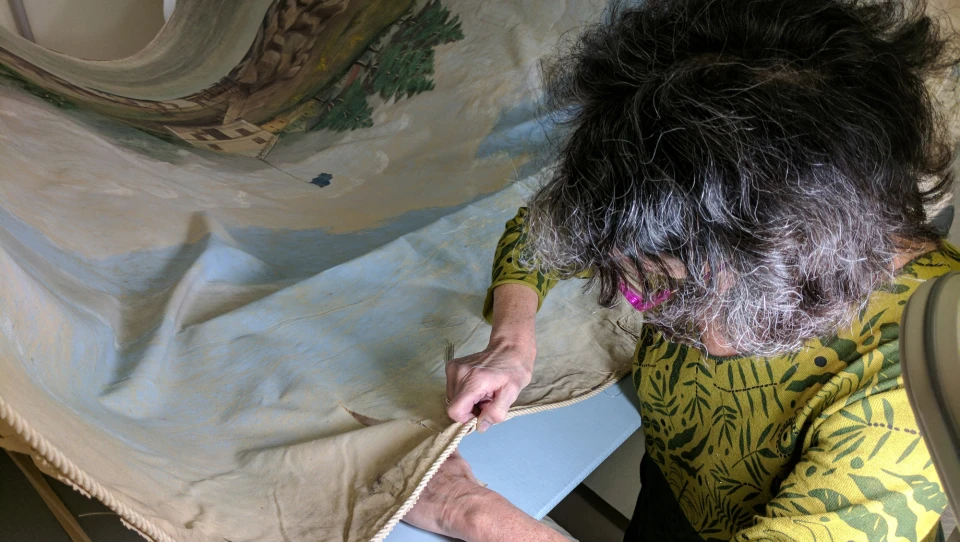 ?url=https%3A%2F%2Fk1-prod-gbh.s3.us-east-2.amazonaws.com%2Fbrightspot%2Fd0%2F1d%2F4dbd045039db1485855a90496946%2F2017-1-26-charlotte-hamlin-at-work-2.jpg Charlotte Hamlin works on restoring what is believed to be the longest painting in the world.