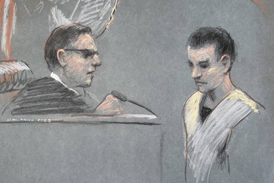 A court sketch shows a judge looking down at Teixeira, in prison garb with his head lowered
