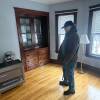 A man stands in his apartment