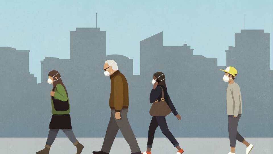Pedestrians in flu masks walking in city