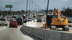 Construction workers build along State Road 836 in 2018 in Miami. HB 1191 would compel the Florida Transportation Department to study using phosphogypsum in paving projects.