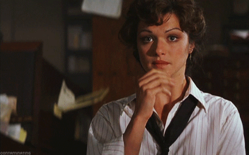 Actress Rachel Weisz, a dark haired, olive-toned woman, puts her hand over her mouth and looks around herself, concerned, in a clip from the film "The Mummy."