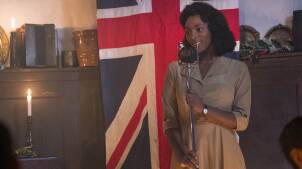 Connie (YRSA DALEY-WARD) sings in a candlelit room