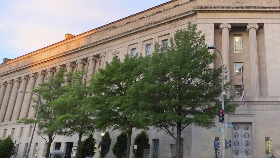 Work at the Justice Department's headquarters in Washington has been slower than normal because of the government shutdown. Even so, it's calling attention to administration priorities about the Southern border.