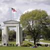 People walk back and forth across the border between the U.S. and Canada in Peace Arch Park in Blaine, Wash., on May 17. With the border closed to nonessential travel amid the global pandemic, families and couples across the continent found themselves cut off from loved ones on the other side. The park reopening reunited many of them.
