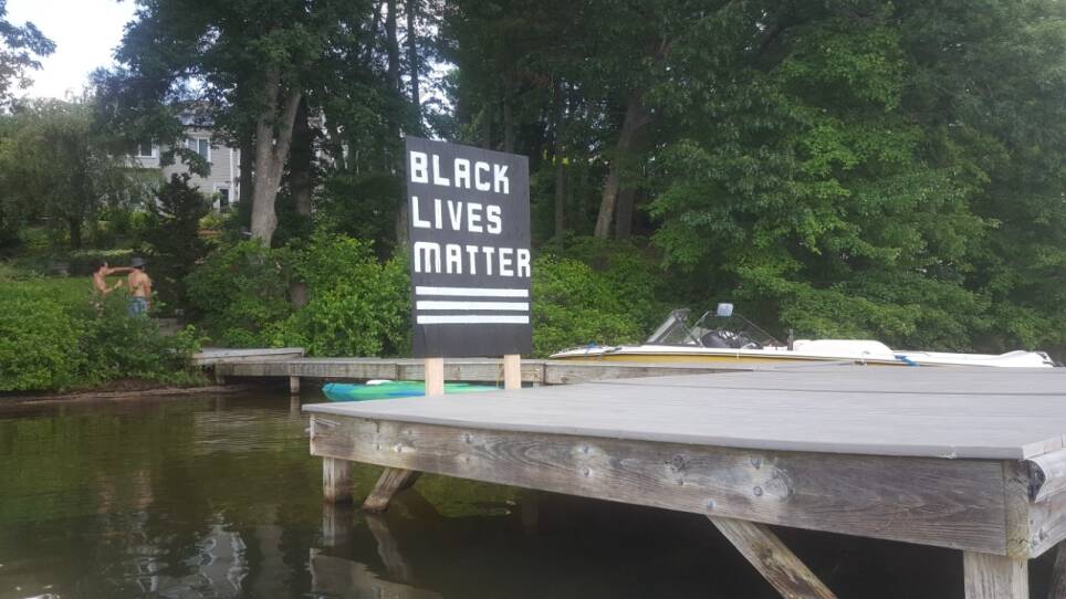 A Black Lives Matter sign built on a dock.