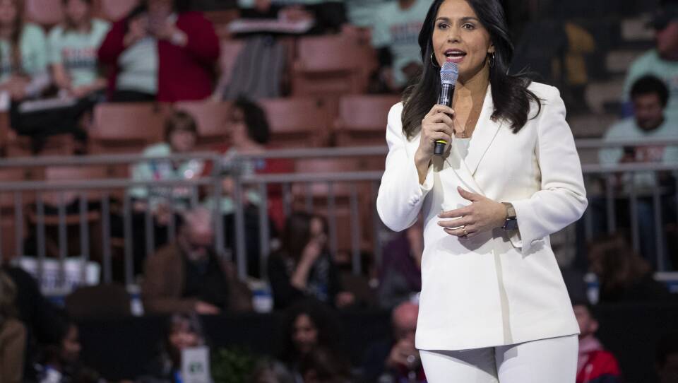 In this Feb. 8, 2020, file photo, Democratic presidential candidate Rep. Tulsi Gabbard, D-Hawaii, speaks during the McIntyre-Shaheen 100 Club Dinner in Manchester, N.H.