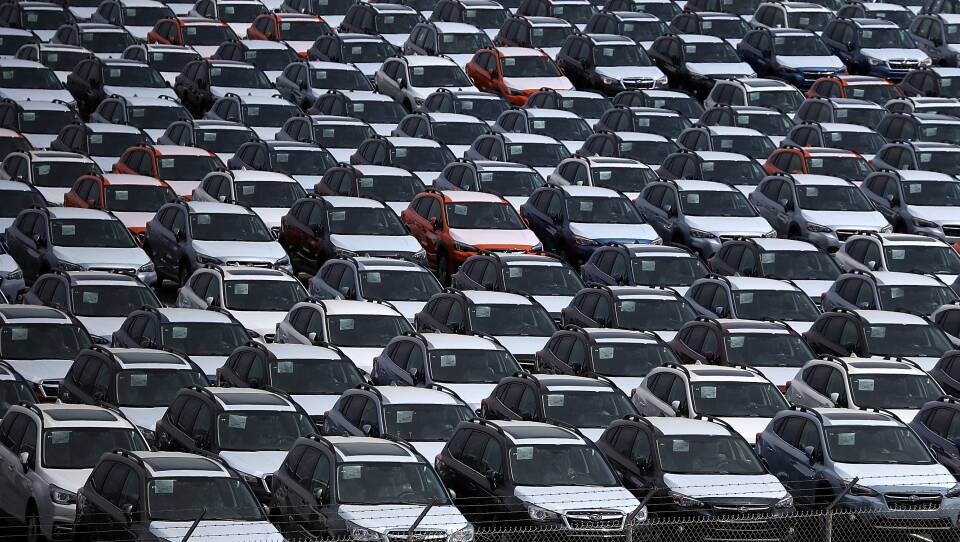 New cars sit in a lot at the Port of Richmond in California on May 24, 2018. The Trump administration on Friday announced a six-month delay in setting new tariffs on auto imports.