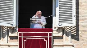Pope Francis waves from the window of the apostolic palace during the weekly Angelus prayer on March 12, 2023 in The Vatican.