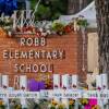 A memorial is seen outside Robb Elementary School in Uvalde, Texas, following the attack there this week in which 19 students and two adults were killed.