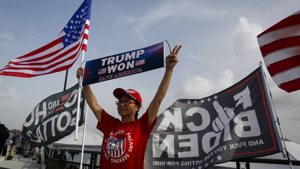 Supporters of former US President Donald Trump outside Mar-A-Lago in Palm Beach, Florida, US, on Tuesday, Aug. 9, 2022. Donald Trump faces intensifying legal and political pressure after FBI agents searched his Florida home in a probe of whether he took classified documents from the White House when he left office, casting a shadow on his possible run for the presidency in 2024.