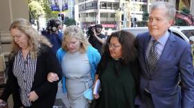Steve Johnson, right, with his sisters, Terry, left, and Rebecca and his wife Rosemarie, second right, arrive at the Supreme Court in Sydney, Monday, May 2, 2022, for a sentencing hearing in the murder of Scott Johnson, Steve, Terry and Rebecca's brother.