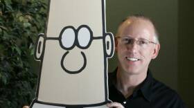 FLE - Scott Adams, creator of the comic strip Dilbert, poses for a portrait with the Dilbert character in his studio in Dublin, Calif., Oct. 26, 2006. Several prominent media publishers across the U.S. are dropping the Dilbert comic strip after Adams, its creator, described people who are Black as members of "a racist hate group" during an online video show.
