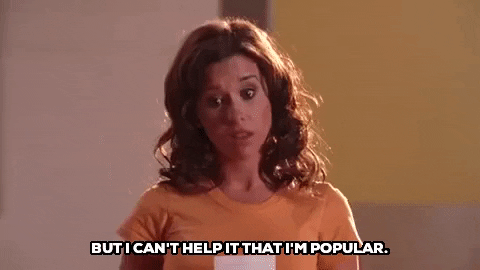 A woman says "But I can't help that I'm popular."