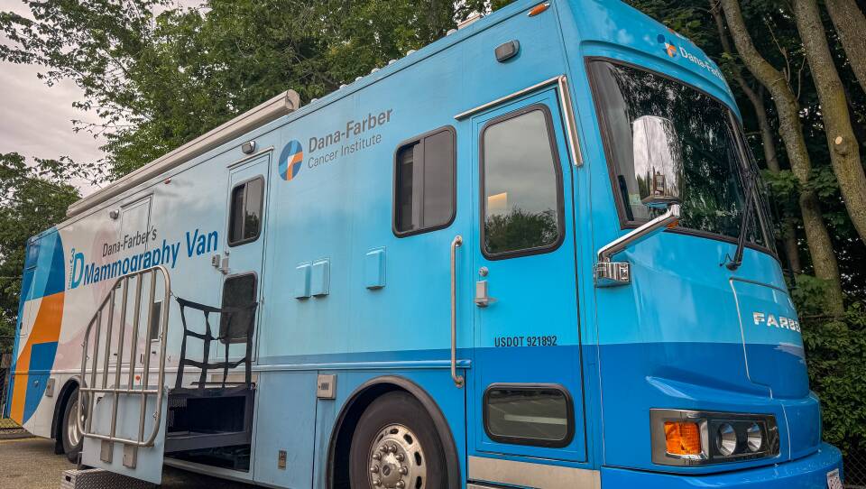 A colorful RV in shades of blue with a logo identifying it as Dana Farber's Mammography Van.