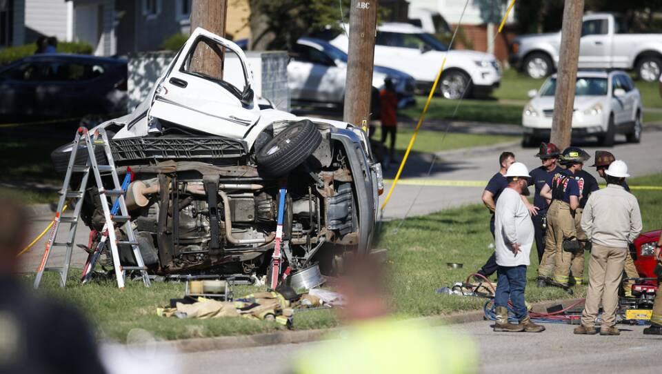 Emergency workers work the scene of a fatal car accident in August 2021 in Tulsa, Okla. Nearly 43,000 people died in U.S. traffic crashes in 2021, with deaths due to speeding and impaired or distracted driving on the rise.