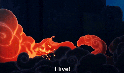 An animated dragon rises from the ground, arms outstretched, and says "I live!"
