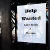A restaurant posts a "Help Wanted" sign for line cooks and servers on June 22 in Los Angeles. Restaurants are seeing surging demand, but they are still struggling to recruit staff.