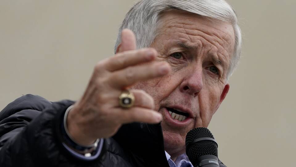 Missouri Gov. Mike Parson speaks during a campaign rally at a gun store in Lee's Summit, Mo., last October. Parson has signed into law a measure that could fine state and local law enforcement officers $50,000 for helping to enforce federal gun laws.
