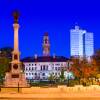 The dark blue night sky hangs over Worcester Commons and City Hall during autumn.
