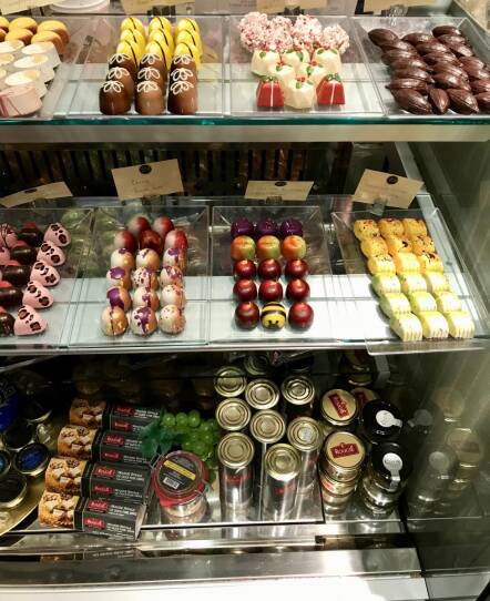 A display case full of chocolates from all over the world.