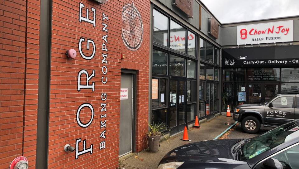 A brick wall with the name of Forge Baking Company written on it.