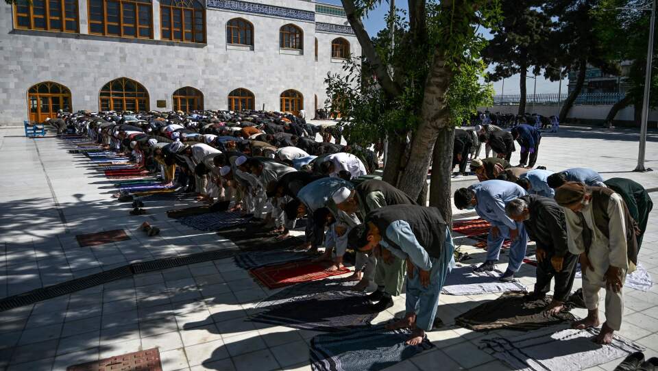 Muslim worshipers in Kabul offer prayers Sunday at the start of Eid al-Fitr, which marks the end of the Muslim holy month of Ramadan. The Taliban announced a three-day ceasefire during the holiday, a surprising move after months of bloody fighting.