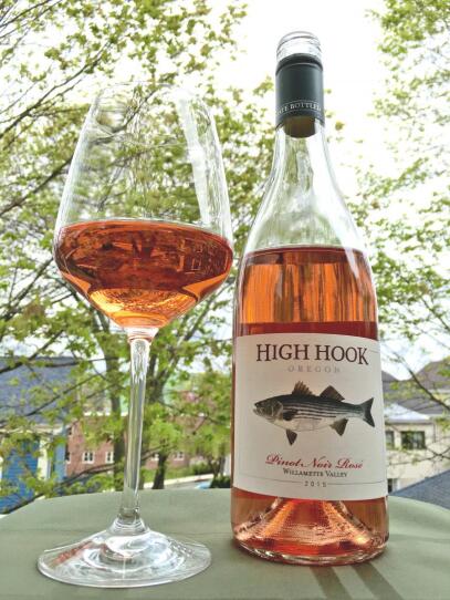 A glass of High Hook Pinot Noir Rosé 2015, next to the bottle.