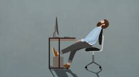 Tired businessman sleeping at desk