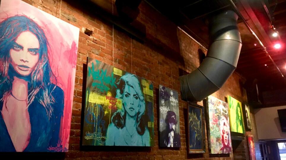 Paintings hanging at Good Life.