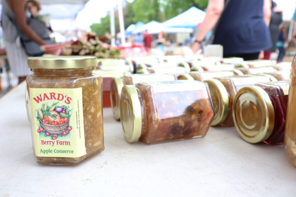 Jars of Ward's Berry Farm Apple Conserve at the farmers market at Harvard University, Cambridge, MA.