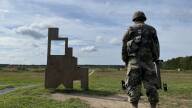 A guardsman waits to fire on the Sierra Range at Camp Edwards on Joint Base Cape Cod. It is a 300 meter automated rifle qualification range where soldiers are tested on rifle marksmanship.