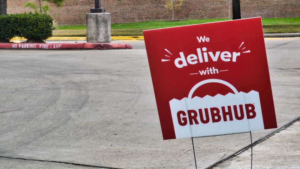 Grubhub sign posted in the ground in Humble, Texas.